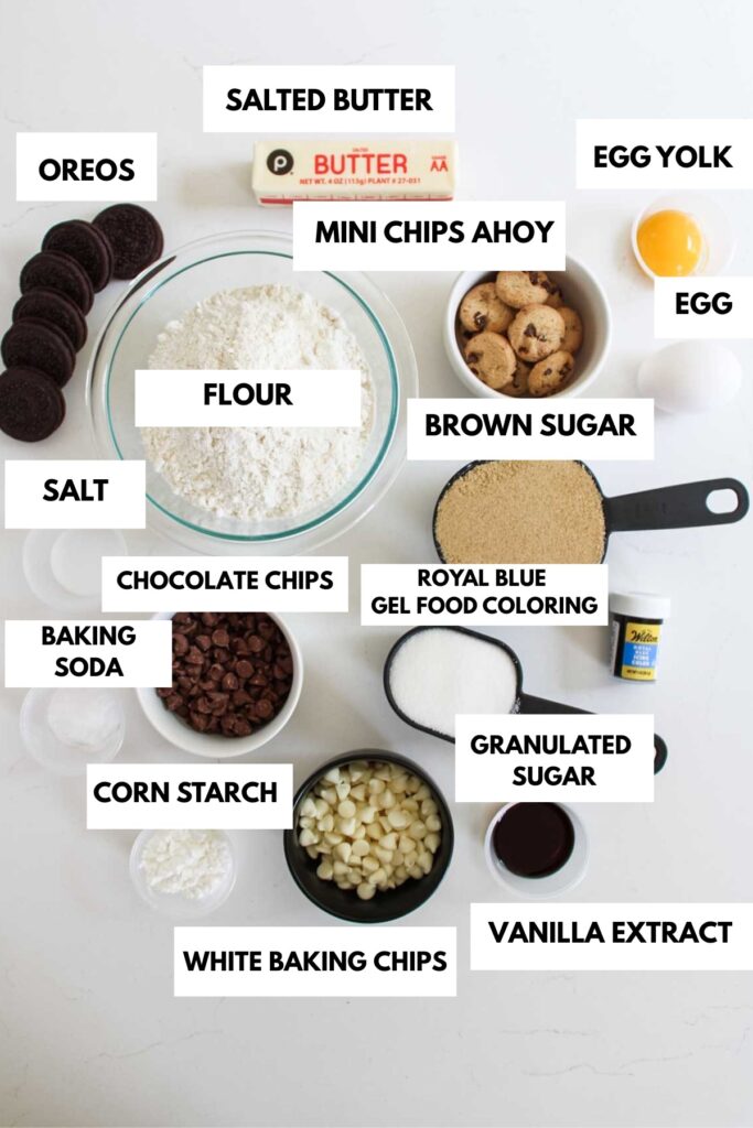Ingredients for baking: flour, sugars, butter, eggs, baking soda, salt, chocolate chips, Oreos, and food coloring.